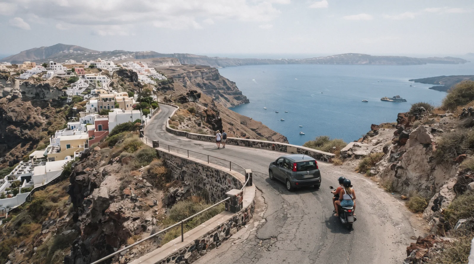 A narrow road winding along the caldera rim near Imerovigli with a small car and a scooter, getting around santorini, Santorini Greece