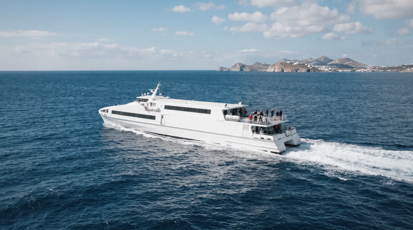 A white high-speed catamaran ferry crossing the open Aegean at 11:00 with a long wake, mykonos to santorini ferry, Santorini Greece