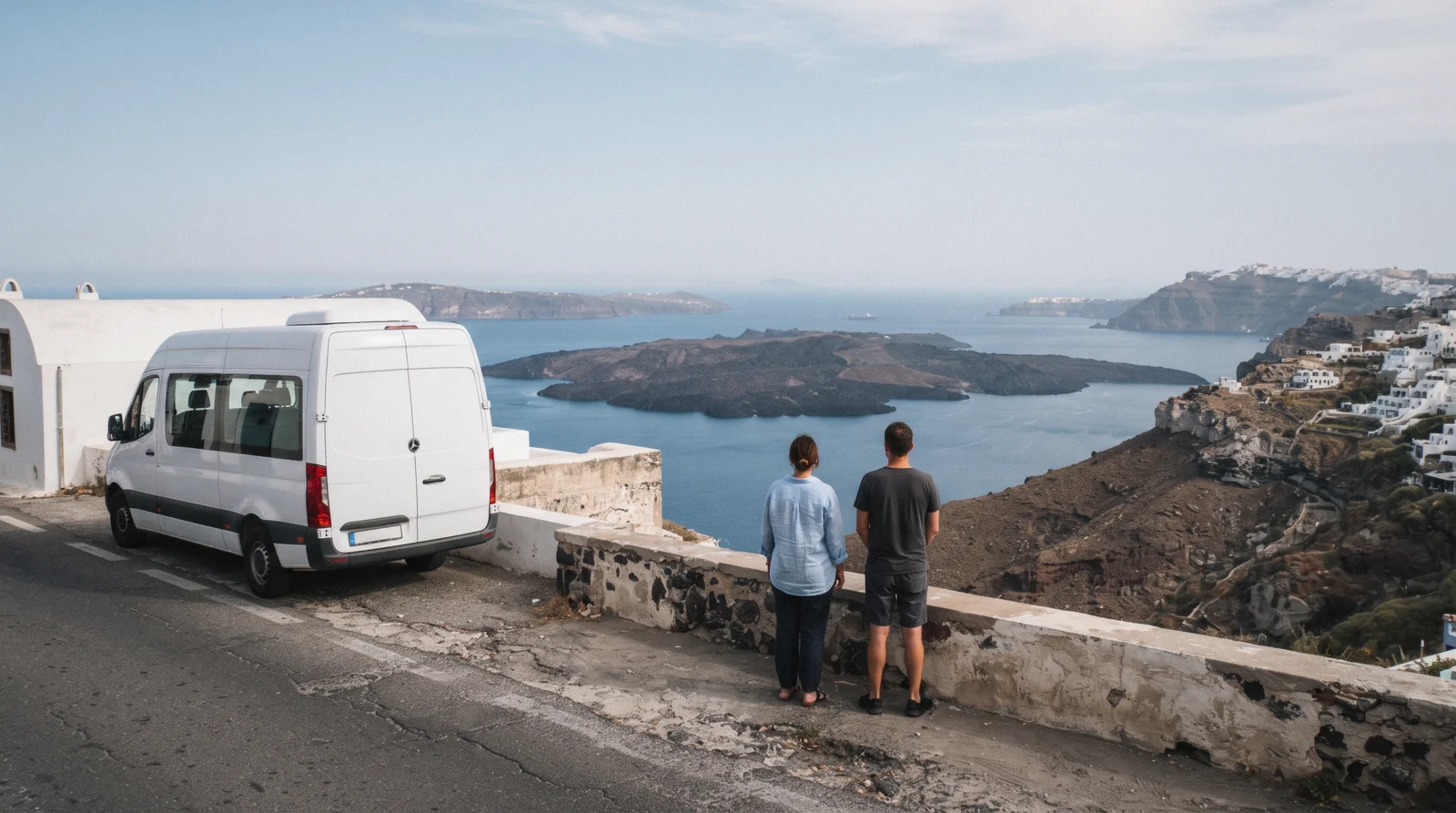 A small white minibus parked at a caldera viewpoint near Imerovigli at 09:00, santorini tours, Santorini Greece