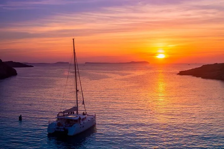 Akrotiri lighthouse from the water on a luxury Santorini sunset catamaran cruise, Santorini Greece